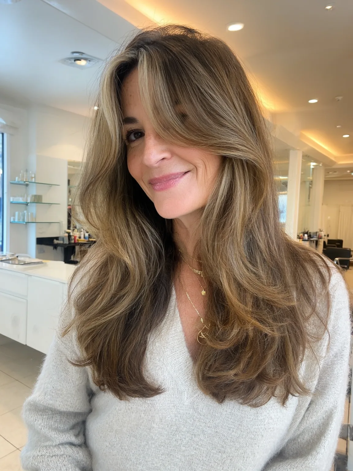 Long Honey Brown Layered Waves with Side-Swept Bangs